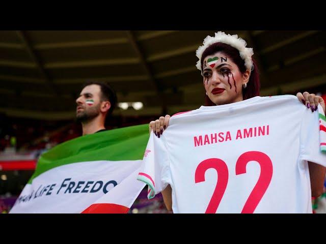 Iran players sing national anthem | pro-government supporters confront protesters at World Cup