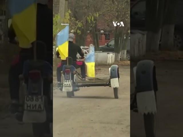 Ukrainian Flag Returns to Kherson Village #shorts  | VOA News