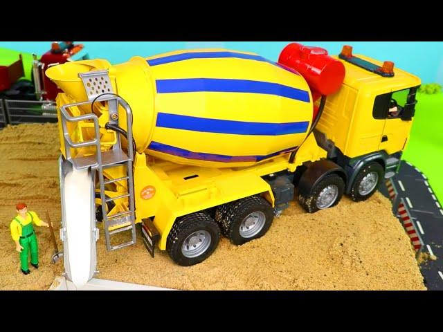 A Concrete Mixer and other Toy Vehicles