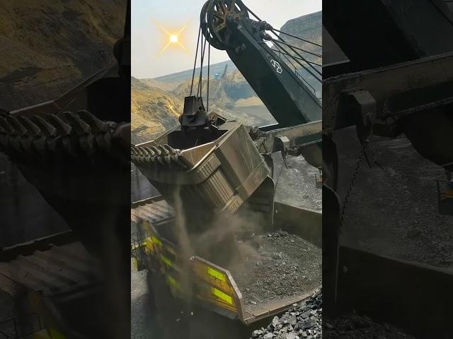 Bucket loading of open pit coal ore- Good tools and machinery make work easy