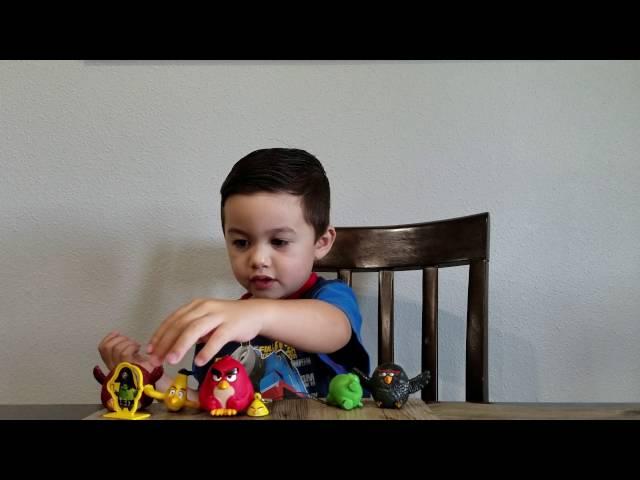 Mason shows his angry birds toys