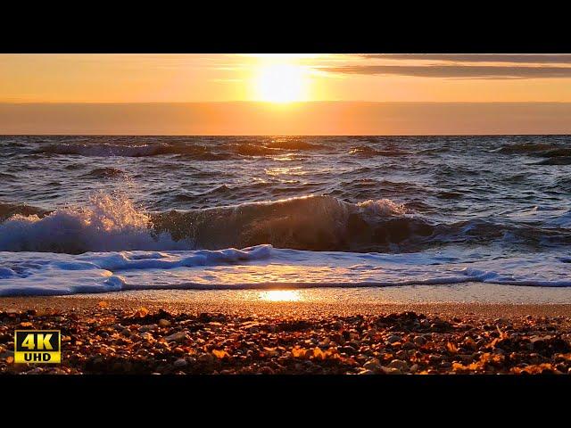 Dawn and sunrise over the Sea of Azov. Arabat Strilka, Ukraine. Video 4K