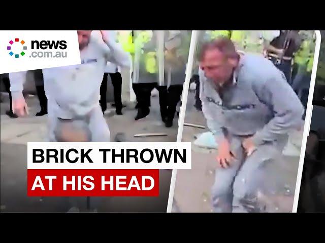 Violent protest sees UK man pelted with bricks