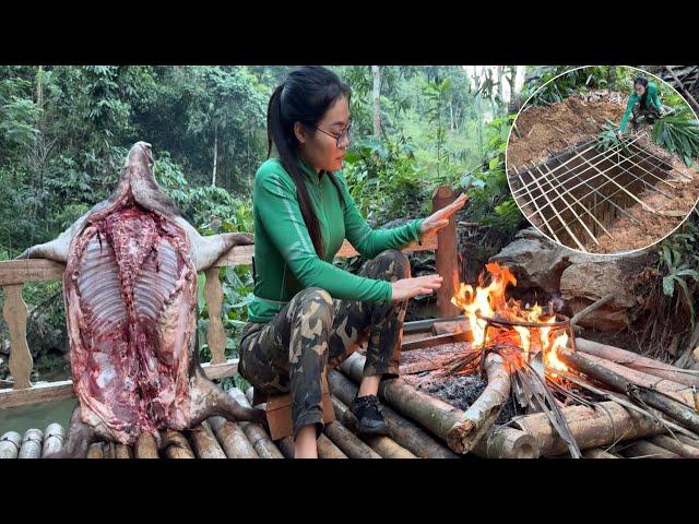 The girl set a trap to catch wild boars in the rainforest.