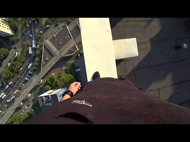 Parkour Runner Misses Jump And Falls Off High Rise Roof, Catches Himself On Electric Wires