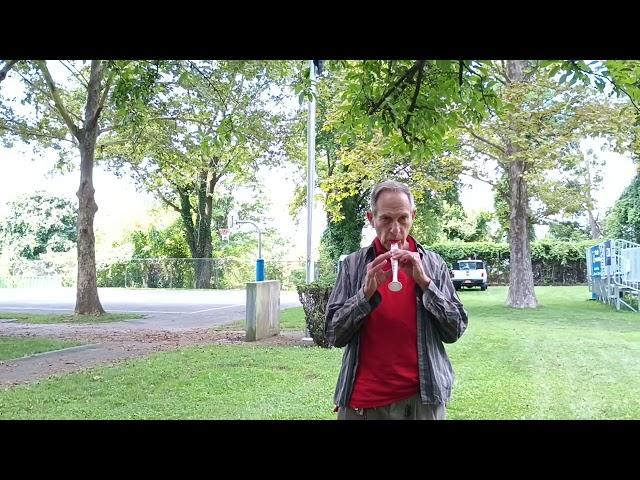 Phillip W. Weiss, the street singer, playing the flutophone, July 28, 2023