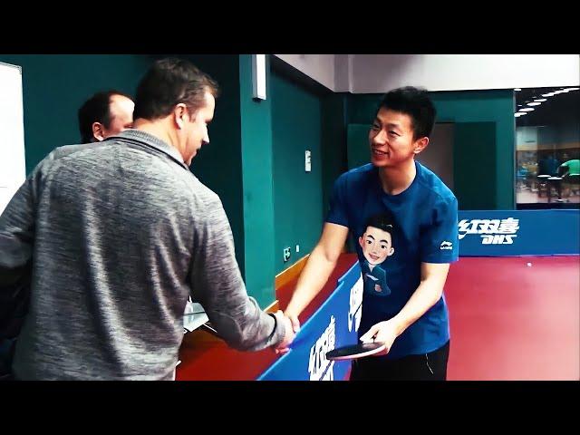 Jan Ove Waldner checks Ma Long Racket