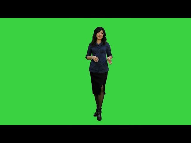 young asian women standing and talking to a camera on a green screen chroma key