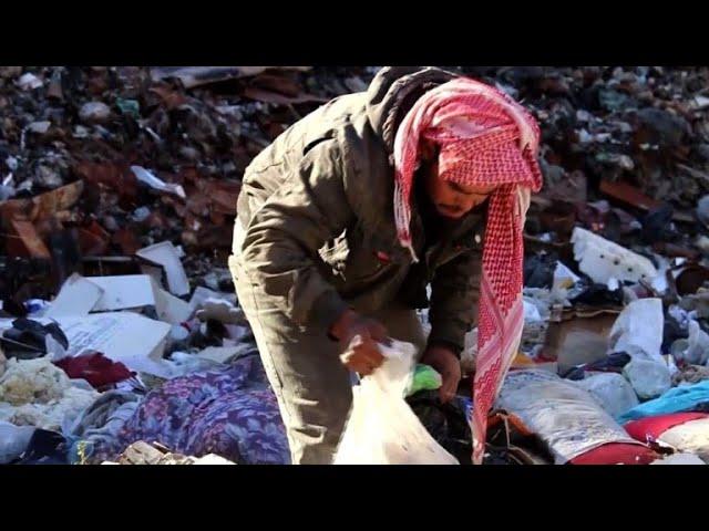 To survive in Syria, displaced people search garbage