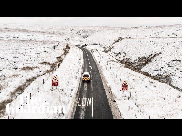 Snowfall across the UK causes school closures and travel disruptions