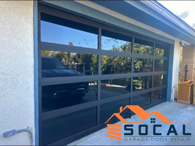 Full-View Black Glass Garage Door Installation | SoCal Garage Door Repair Inc.