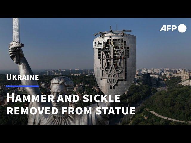 Ukraine puts trident in place of Soviet emblem on tallest statue | AFP