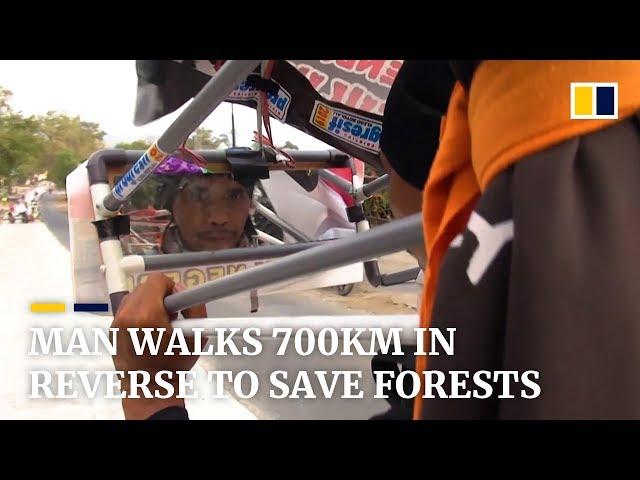 Indonesian man walks 700km in reverse to save forests