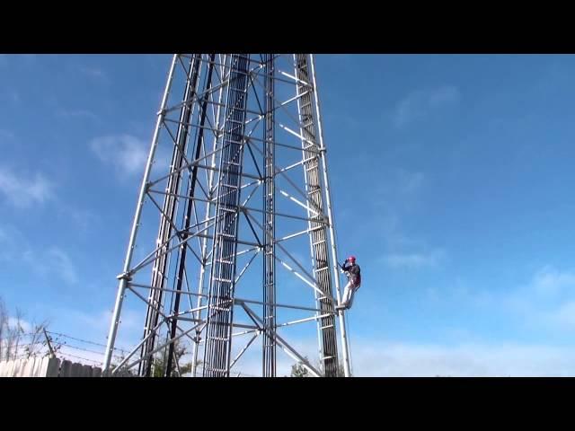 Real-life MasTec Network Solutions' tower technician at work, just getting started.