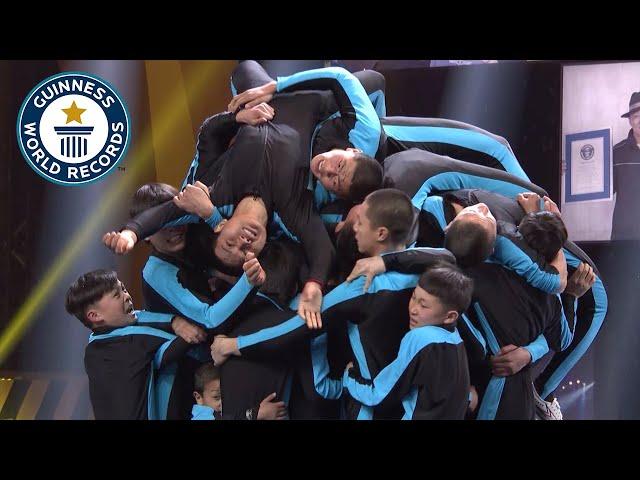 How Many People Can Front Flip Onto A Small Platform? - Guinness World Records