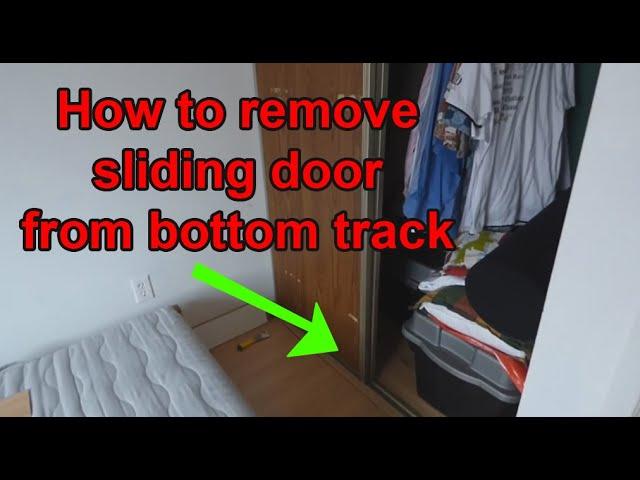 how to remove sliding closet door from bottom track (plastic guides)