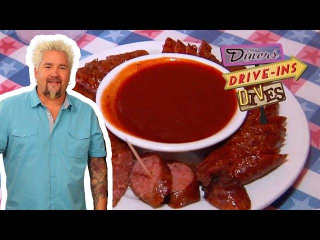 Guy Fieri Sees How the Sausage Is Made at T-Bone Tom's | Diners, Drive-Ins and Dives | Food Network