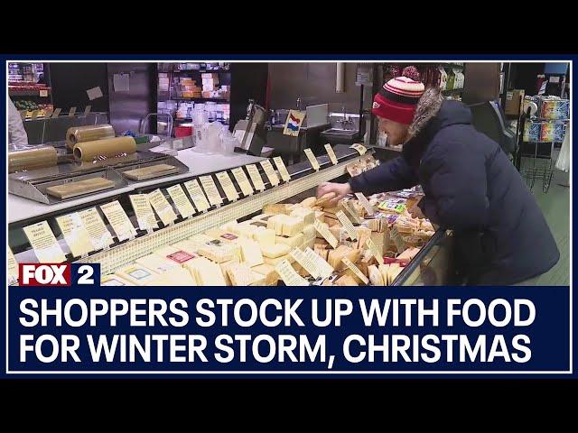 Shoppers stock up with food for winter storm, Christmas