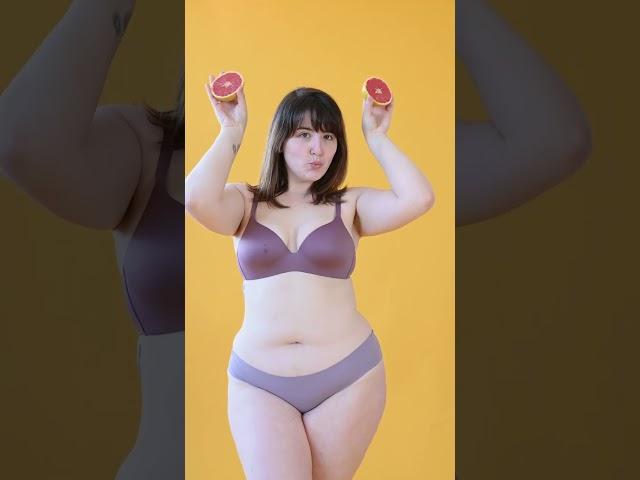 Plus Size Woman in Underwear Posing while Holding Grapefruit Slices