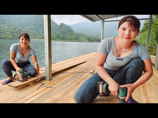 Girl makes wooden floors and houses floating on water.