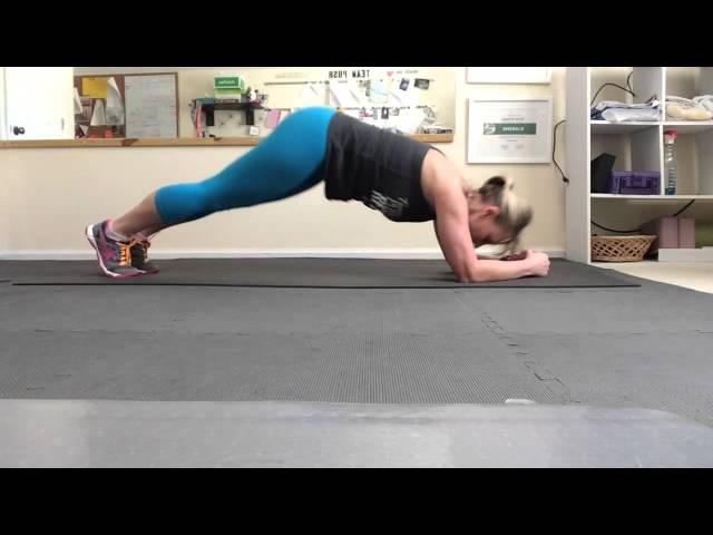 Dolphin plank exercise from the 21 Day Fix Extreme workout program.