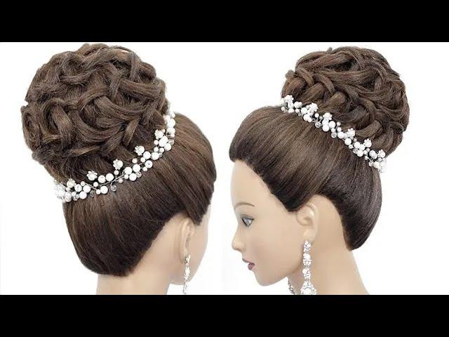 High bun updo. Hairstyle for long hair