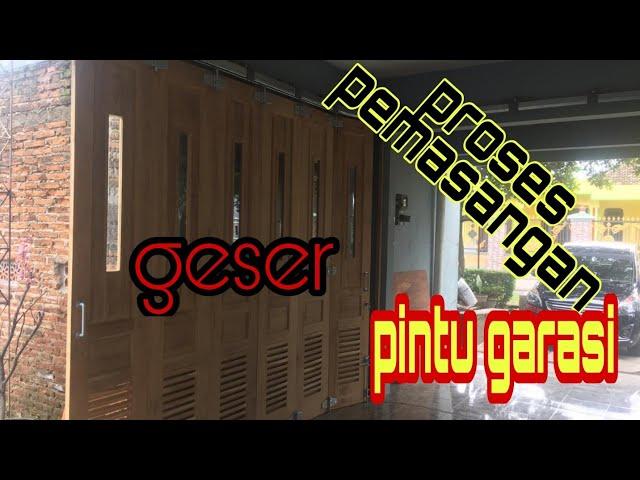 proses pemasangan pintu garasi rel geser loncer