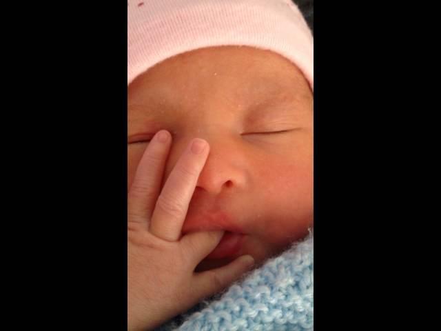 baby born sucking her own thumb