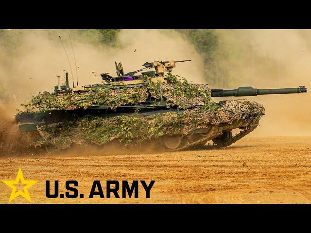 US Army. Powerful M1A2 Abrams tanks and infantry fighting vehicles in action.