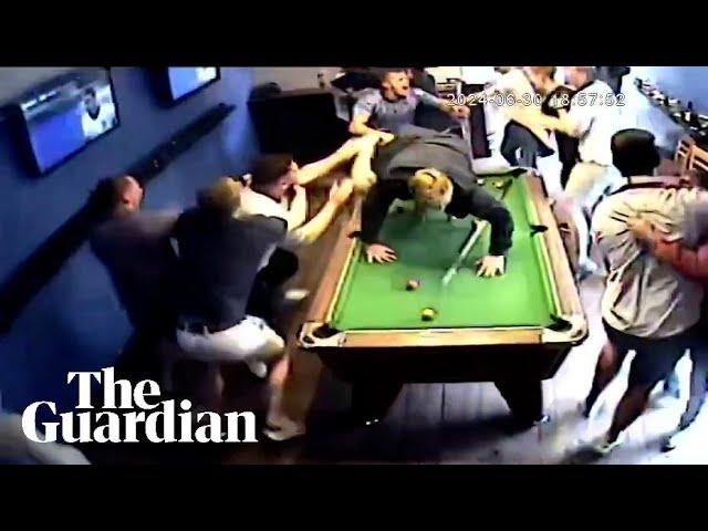 Fans dive across pool table in euphoric celebration of Jude Bellingham goal