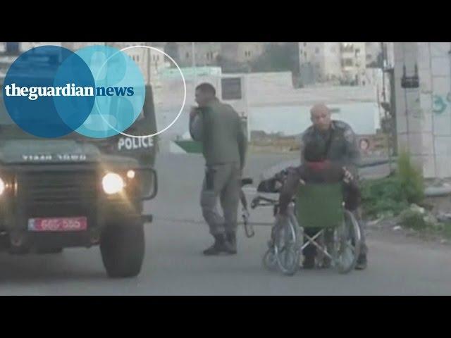 Israeli policeman pushes Palestinian out of wheelchair