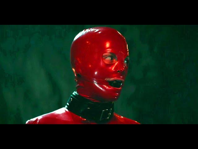 Who is the Guy in the Red Latex?