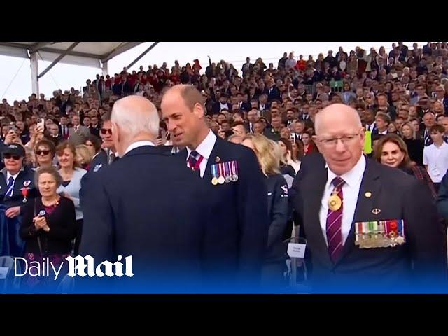 Moment Prince William and Joe Biden meet at D-day commemoration