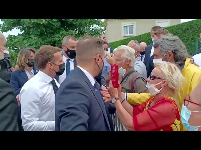 The moment Macron gets slapped during meet-and-greet