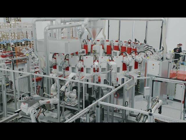 Shoe factory - STEMMA Automated conveyor line and polyurethane direct injection machine