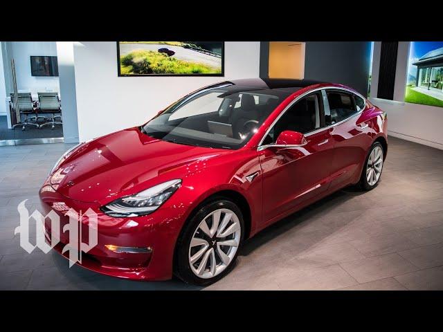 Drivers line up to see the Tesla Model 3 for the first time