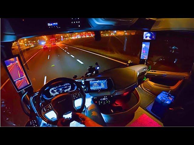 A quiet POV night drive in a Nikotimer truck with low beam headlights on the highway