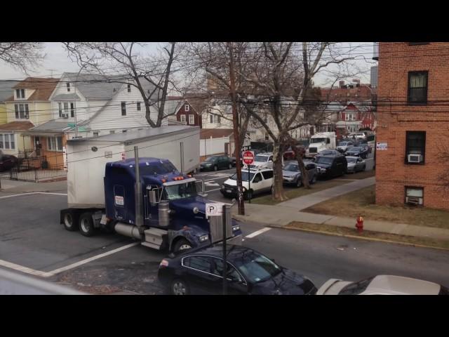 truck making tight turn on residental street