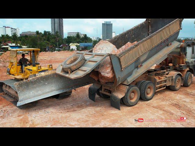 Incredible! TRAGO 25.5 ton dump trucks dumping huge rocks with Komatsu D68E bulldozer pushing rocks