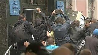 Riot police surrender to protesters in Donetsk chaos | ITV News