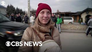 Women and children leave Ukraine as men stay behind to defend it