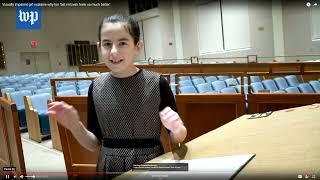 Batya sings-reads from her Braille Hebrew Bible at her Orthodox Bat Mitzvah ceremony