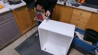 Cutting a cabinet with a circular saw to get around a pipe