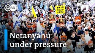 Thousands protest in Israel as cracks show in war cabinet | DW News