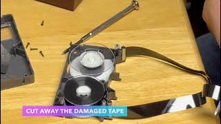 VHS-C Cassette Tape Repair - Videotape torn, open video cassette shell, spliced, taped, reassembled