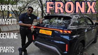 FRONX WITH PREMIUM INTERIORS, DOORPAD SOFTTOUCH, GENUINE MARUTI ARMREST, CONNECTING TAILLIGHT & MORE