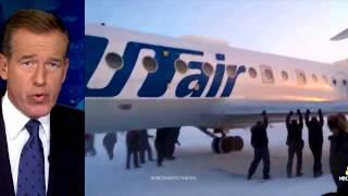 Passengers in Russia Push Frozen Plane in Siberia Loose