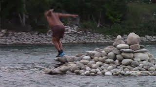 Adrian the  RamBow,  diving from his platform in Bow River Calgary