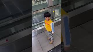 3 years baby trying to defeat fear on escalator and successfully rides after multiple falls #funny