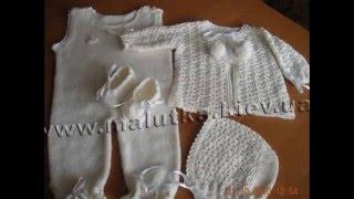 Knitted baptismal sets with crochet and knitting needles.